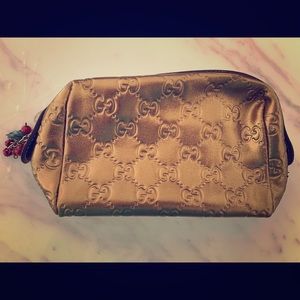 Gold Gucci pouch